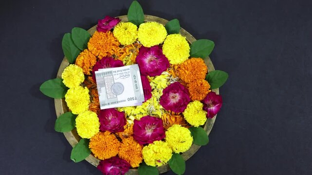 Indian Festival Puja Plate Decoration With Marigold, Rose, And Rupee for holy worship