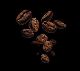 Coffee beans levitate on a black background