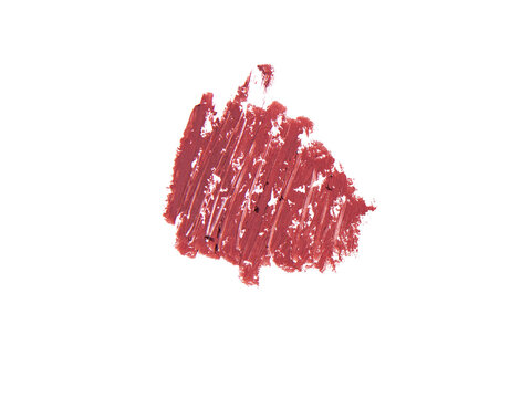 Rich terracotta lipstick swatch, beauty product texture dark background.