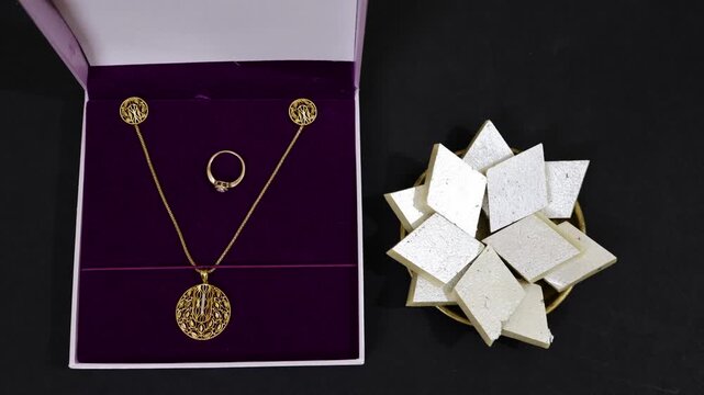 Jewelry Gift Box With Kaju Katli On Black Background