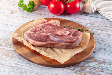 Raw lamb steak with bone