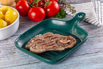 Grilled lamb steak with bone