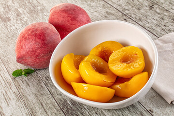 Sweet ripe yellow canned peaches