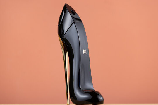 Studio photo of Carolina Herrera Good Girl Eau de Parfum in its iconic stiletto-shaped bottle, isolated against a warm background for illustrative editorial use.
