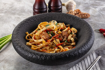 Asian cuisine udon with chicken and vegetables