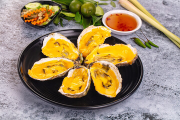 Baked oyster with cheddar cheese