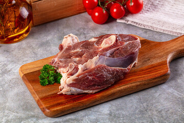 Raw lamb steak with bone