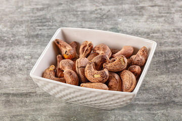 Unpeeled cashew nuts in the bowl
