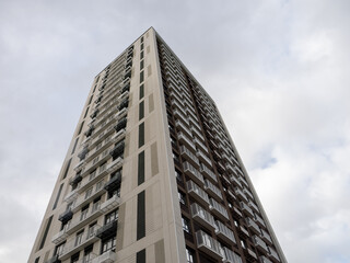 Fototapeta premium The exterior of a modern business center, showcasing its unique architectural design with geometric shapes and patterns.