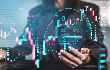 Businesswoman using smartphone with digital financial graph and stock market chart overlay on modern office background, illustrating crypto trends concept.
