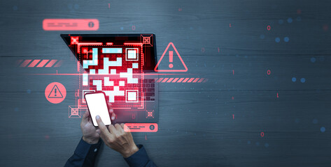 Person scanning dangerous QR code on laptop with smartphone, warning signs and digital virus concept on dark surface background, cybersecurity threat scene.
