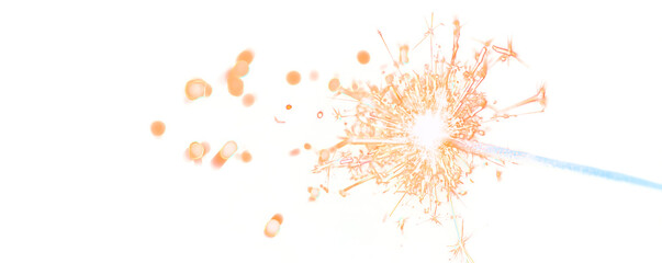 Sparkler in Focus: a captivating capture of a lit sparkler, a radiant display of light against an enigmatic backdrop.