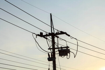 High voltage electric power lines and pylons against a blue sky