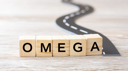 OMEGA wooden blocks end of winding road concept of final destination journey completion goal achievement success motivation hope positive wooden table