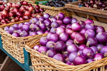 Red onions filling baskets at farmers market stall