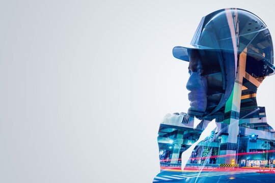 Double exposure of a construction worker wearing a helmet with a cityscape overlay - Powered by Adobe