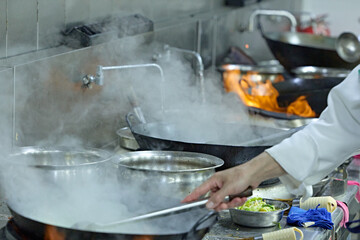People and food Chefs in a busy Chinese kitchen
