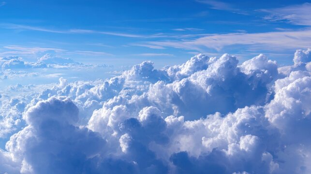 Soaring above a breathtaking ocean of fluffy white clouds under a vast, brilliant blue sky, offering a sense of freedom and endless possibilities for your projects.