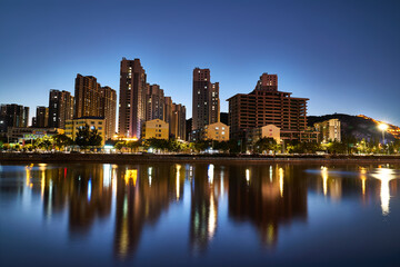 Fototapeta premium Night view of buildings along the Daqing River in Zhangjiakou City,Hebei Province