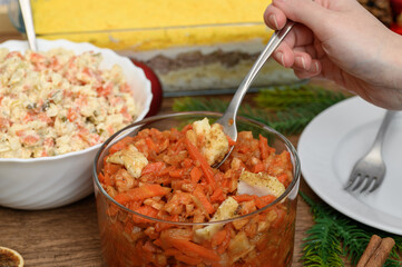 Greek-style fish, pieces of fried fish with carrots, onions and tomatoes