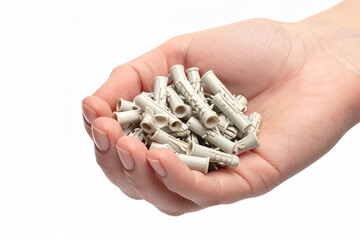 some plastic dowels in the hand