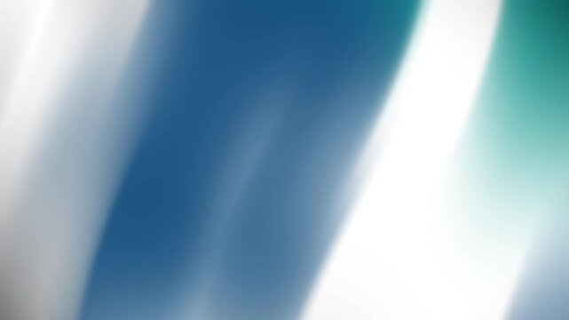 Abstract blurred image with smooth gradients of blue, white, and teal hues blending seamlessly
