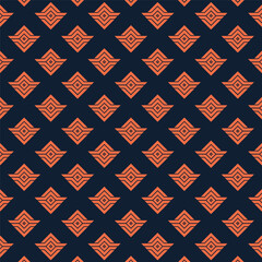 Modern geometric pattern with striking orange diamonds on navy background