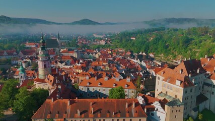 aerial drone footage showcasing the stunning medieval architecture of Český Krumlov, a UNESCO World Heritage site in the South Bohemian Region of the Czech Republic. - Powered by Adobe