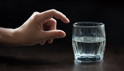 An optimist and a pessimist's opinion about a glass of water © Marina