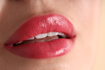 Fototapeta premium Woman with beautiful lipstick on her lips, macro view