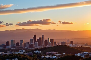 Fototapeta premium Golden hour sunlight paints the Los Angeles skyline, illuminating skyscrapers and distant hills in a vibrant, warm glow, view, sunrise, sun