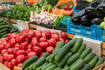 Fresh vegetables on the market counter. Vegetable farmer market counter: colorful various fresh organic healthy vegetables at grocery store. Healthy natural food concept
