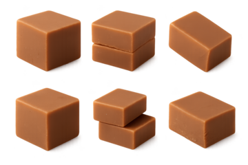 Six caramel fudge cubes with smooth faces arranged on clean transparent background some pieces stacked