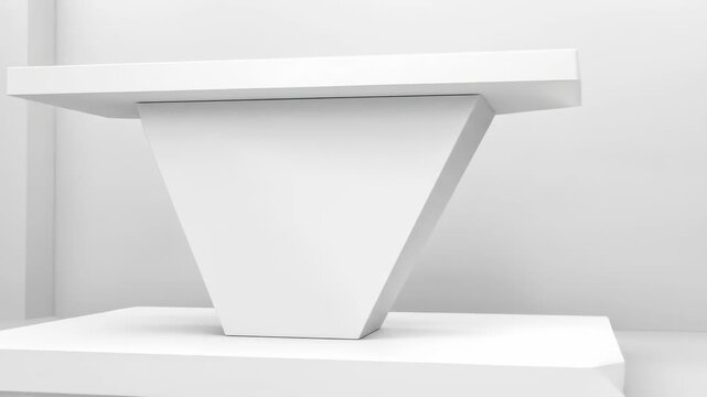 A geometric white pedestal with a wide horizontal surface atop a trapezoidal support. The background is a plain white