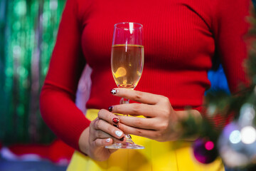Group of friends clinking glasses of champagne together at a festive party, celebrating happiness and friendship with joyful smiles.