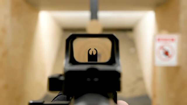 Looking Through Rifle Scope at Target in Indoor Shooting Range