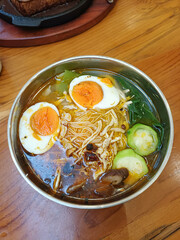 Spicy Chicken Noodle Soup with Boiled Eggs and Vegetables