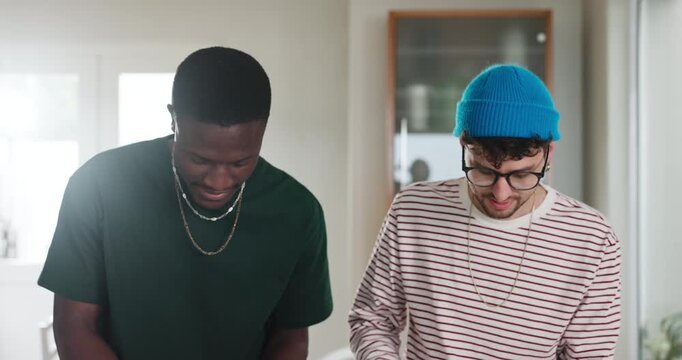 Friends, pizza and men in kitchen for cooking tutorial, baking guide and organic meal prep. Help, food and recipe with online instructions for diet, sauce topping and vegetable ingredients in home