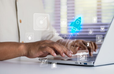 Business growth to target. Startup new project. Rocket launching from laptop to business icon. Represent strategic planning, Goal setting. Investment management. Company strategy. Business vision