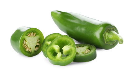Whole and sliced green jalapeno peppers isolated on white