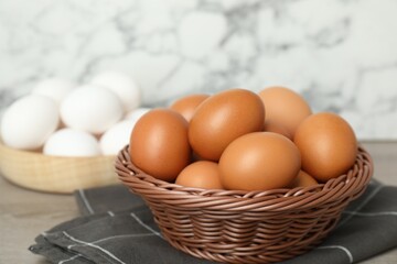 Raw chicken eggs and towel on counter, closeup