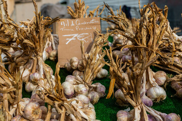 Garlic bundles on sale at a weekly market in the South of France