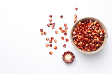 Piece of ripe red corn cob, bowl and kernels on white table, flat lay. Space for text