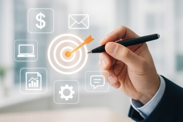 Business Strategy Concept with Target, Hand, Pen, and Digital Icons on Blurred Office Background
