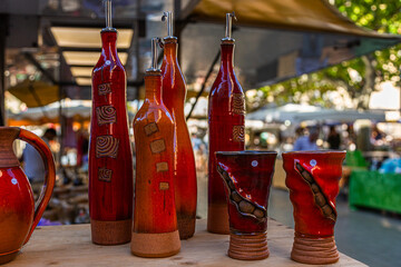 Artistic and colored glass objects at a French market