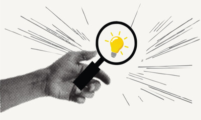 Hand holding magnifying glass highlighting glowing light bulb symbolizing discovery, creative idea, innovation, research and vision
