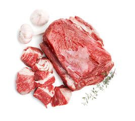 Pieces of raw beef meat and spices isolated on white, top view