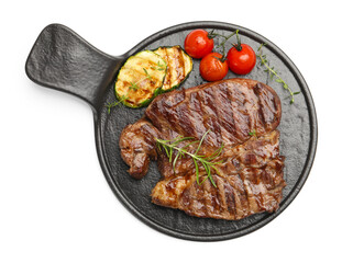 Delicious grilled beef steak with rosemary, zucchini and tomatoes isolated on white, top view