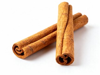 Three aromatic cinnamon sticks arranged on a white background, capturing their rich color and texture.