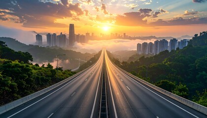 A long, symmetrical highway stretches towards a city skyline under a golden sunrise, with low-lying clouds and trees